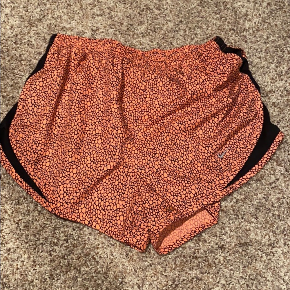 Orange and black Nike shorts